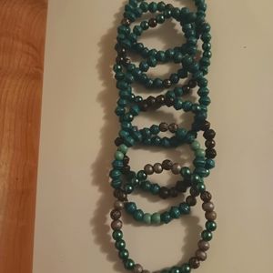 Teal and silver beaded strands with a Festival vibe.